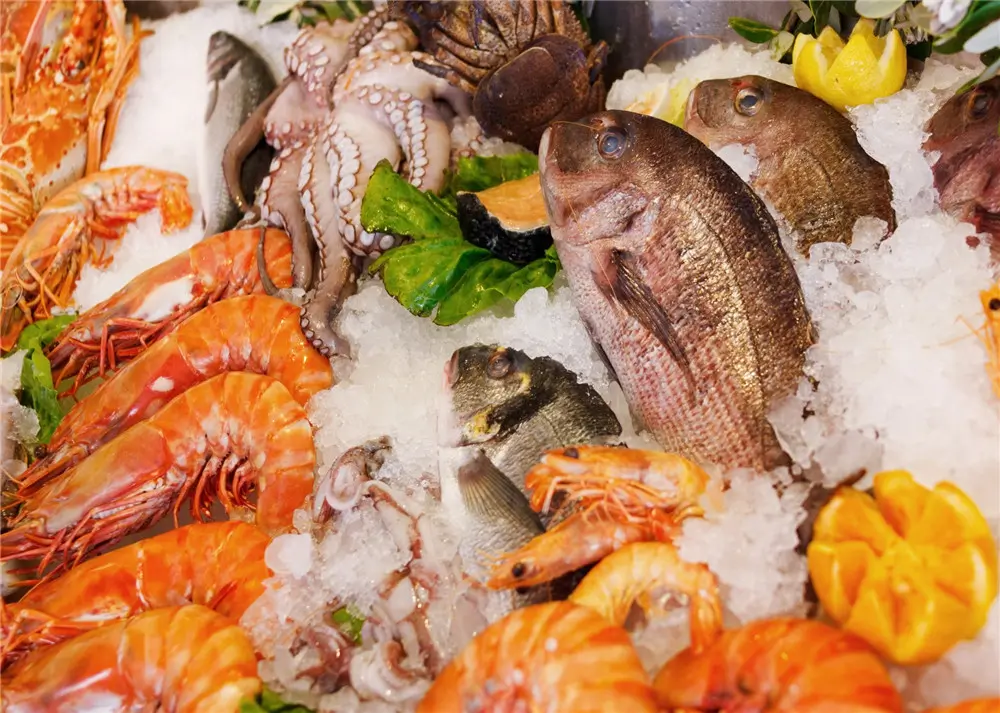 Assorted fresh seafood laid on crushed ice