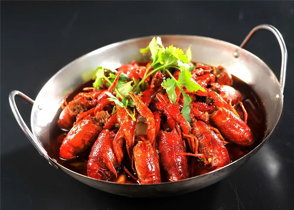 Spicy braised crayfish in metal pot